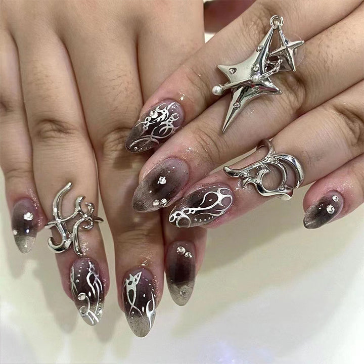 Artistic gel nails with delicate ornaments and glitter Kalsten