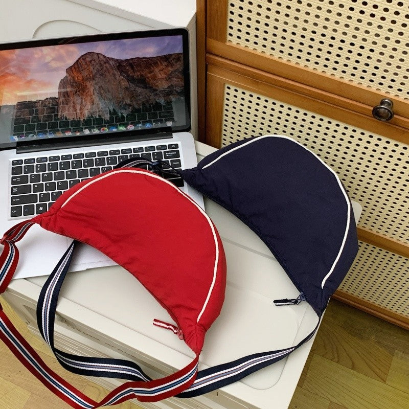 Fashionable shoulder bag with unique cut and adjustable strap Kalsten