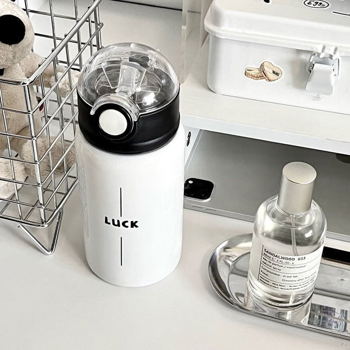 Women's insulated drinking bottle with innovative flip lid and practical handle Kalsten