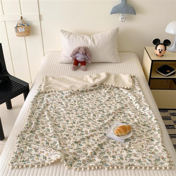 Children's Wende cuddly blanket made of cotton muslin with pompom border