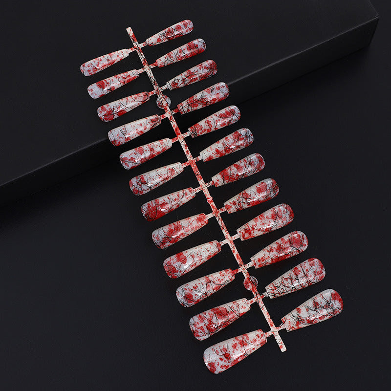 Creative nail art with blood splatter design Kalsten