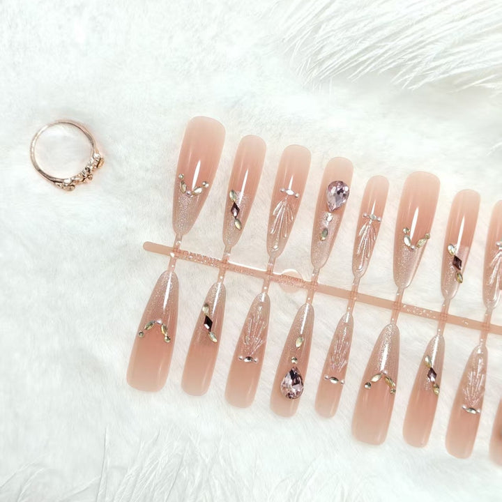 Artificial nails with glamorous crystal embellishments Kalsten