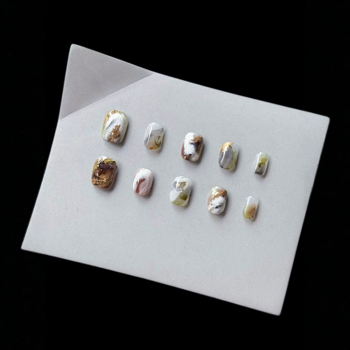Artistic Press-On Nail Art Set with Marble and Gold Accents
