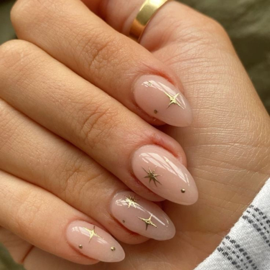 Artful stiletto nails with shiny star accents Kalsten