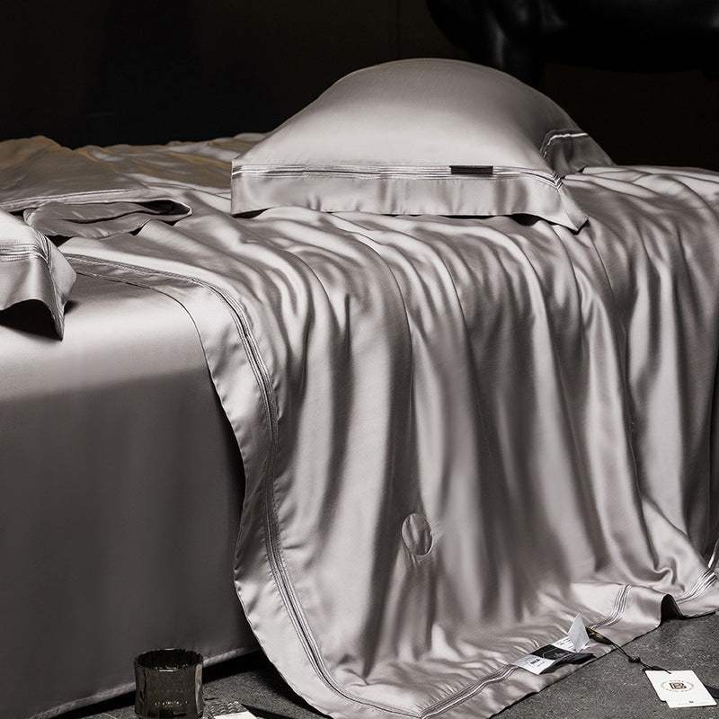 Luxurious satin bed set with silk-like surface and fine decorative stitching