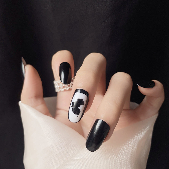 Artistic Press-On Nail Set with Floral and Abstract Designs
