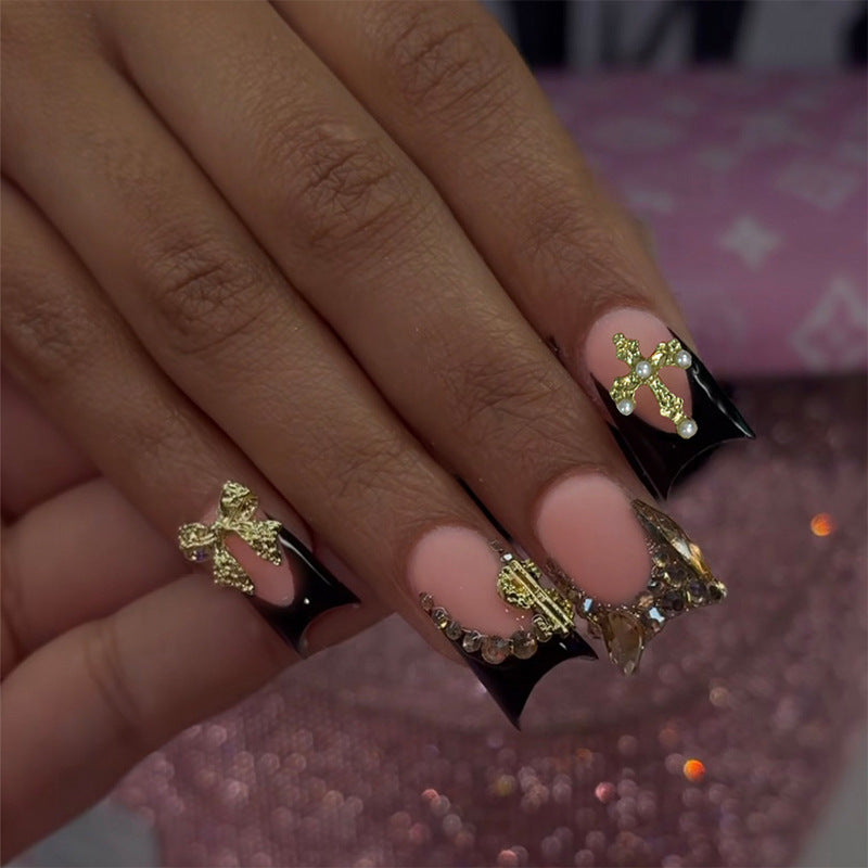 Artificial nails with elegant gold decorations and stylish black Kalsten