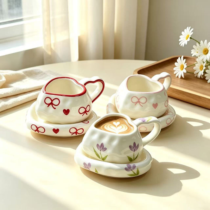 Heart-shaped ceramic cup set with saucer