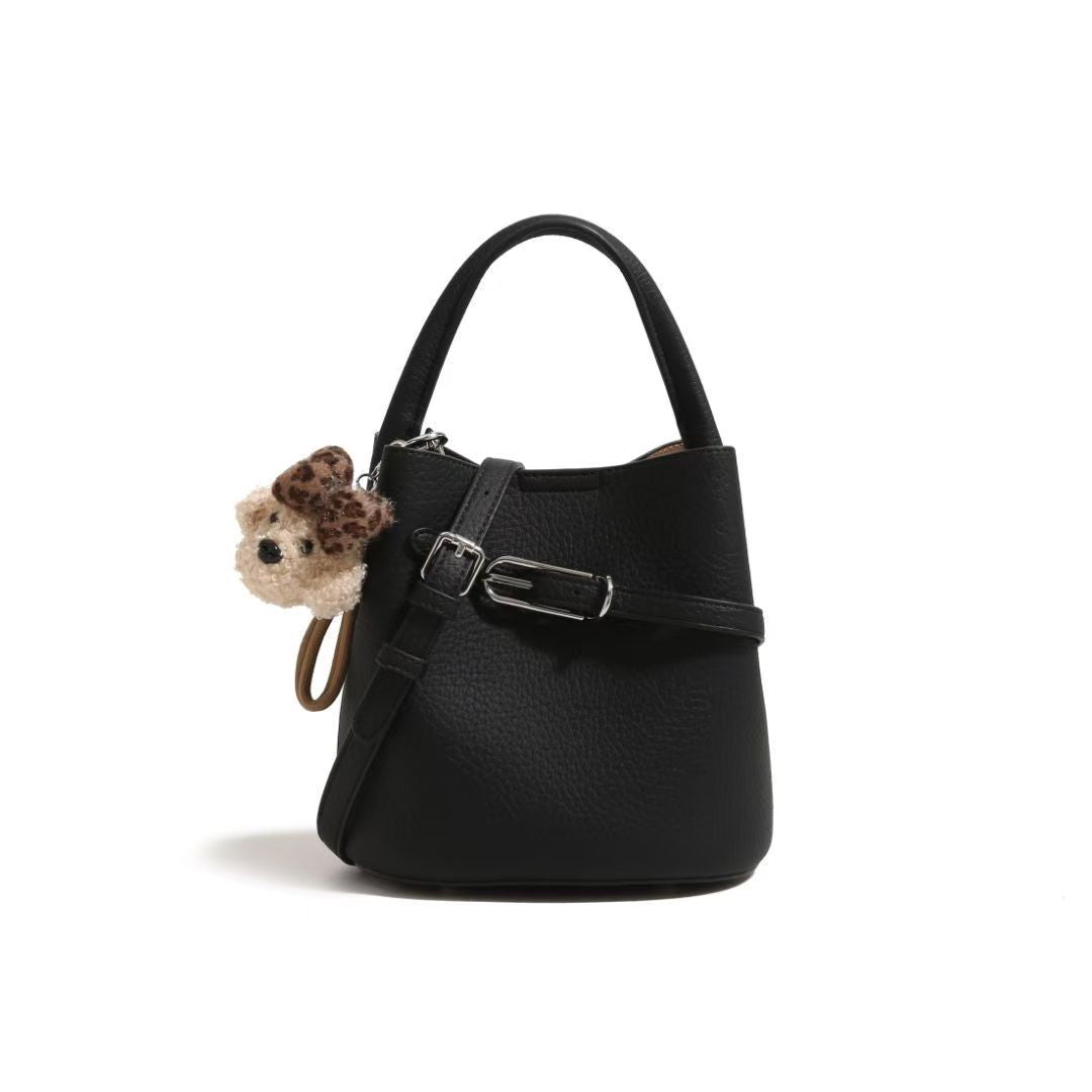 Chic Pebbled Leather Handbag with Cute Charm