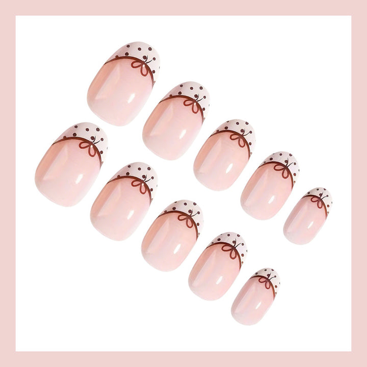 Artificial nail set with elegant bow and dot patterns Kalsten