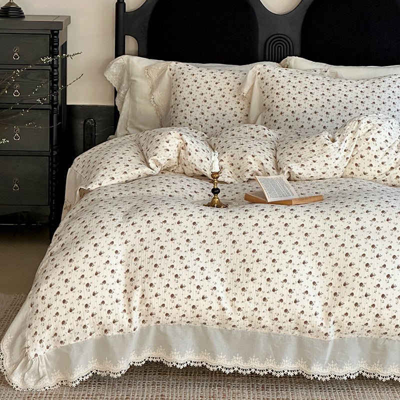Cotton muslin bedding set with ruffles, lace trim, and delicate bow print