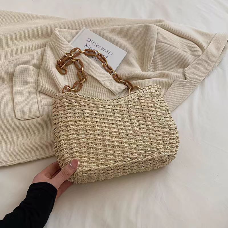Handcrafted straw bag with golden chain details Kalsten