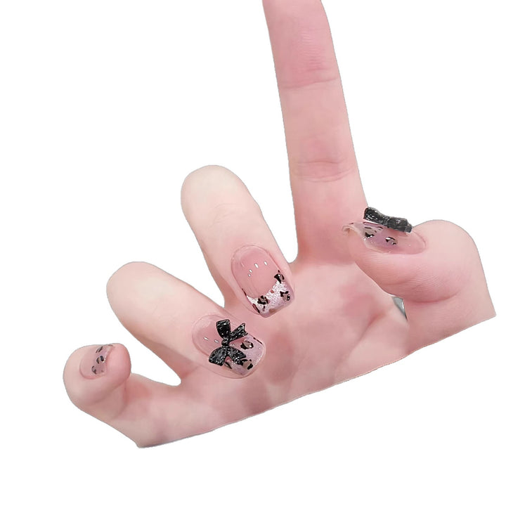 Artistic Press-On Nail Set with Playful Bow and Animal Print Designs