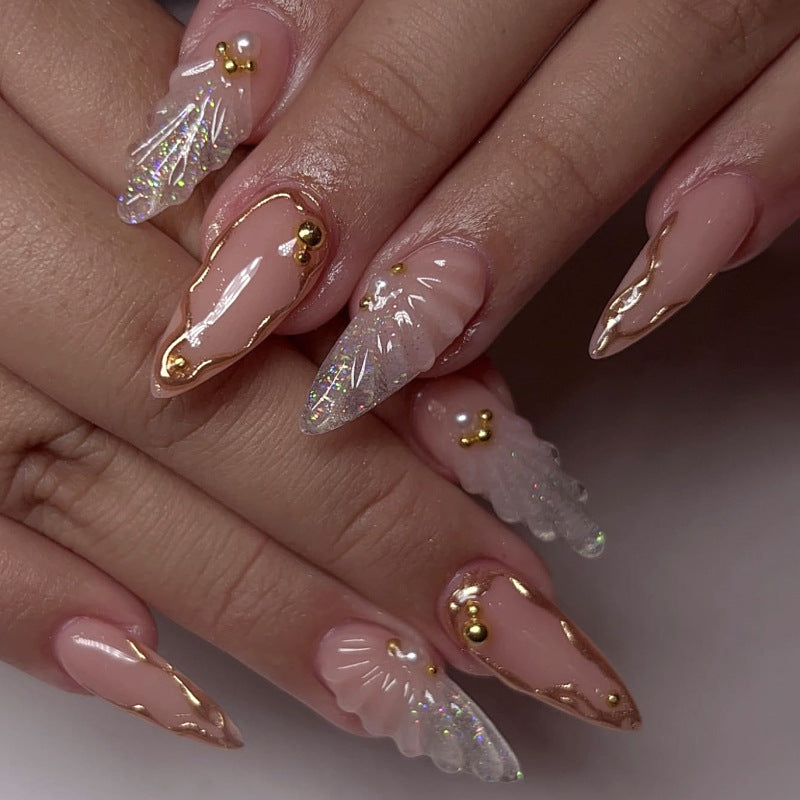 Artful stiletto nails with elegant gold embellishment design Kalsten