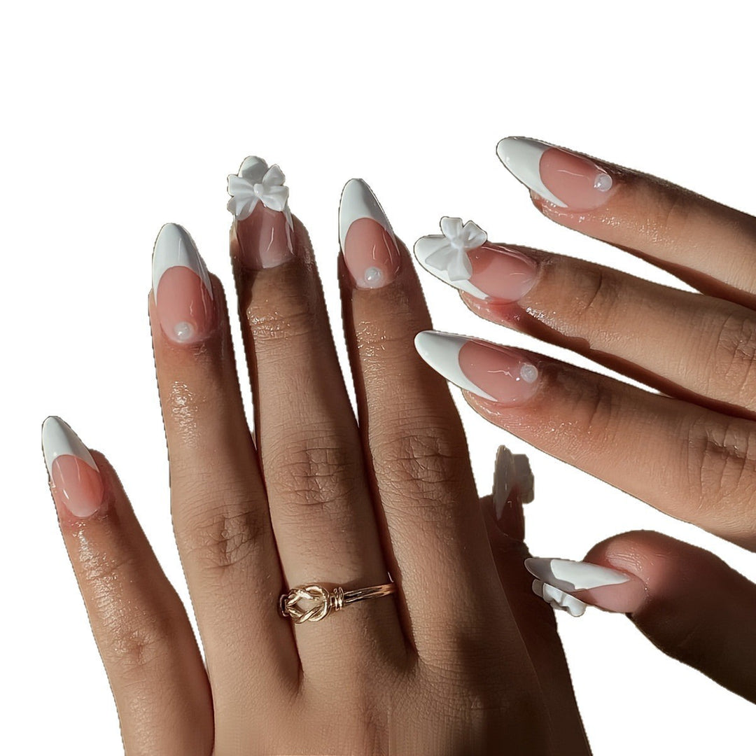 Acrylic nail set with elegant tips and floral accents Kalsten
