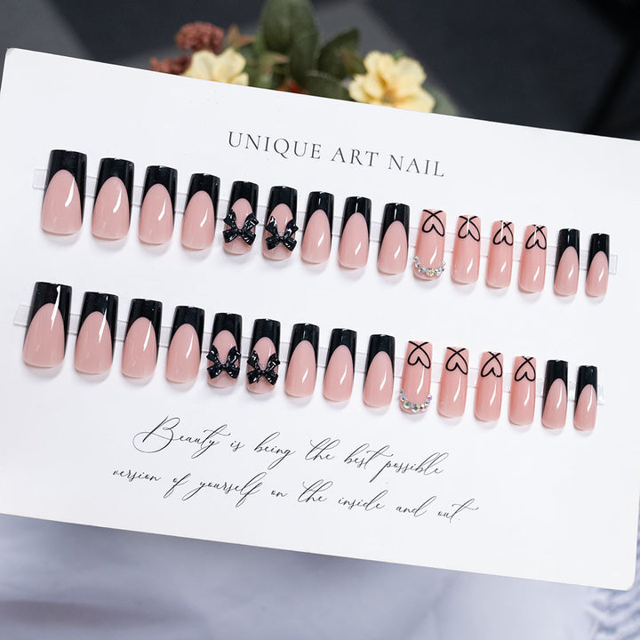 Decorative Long-Stiletto Press-On Nails with Heart and Bow Design