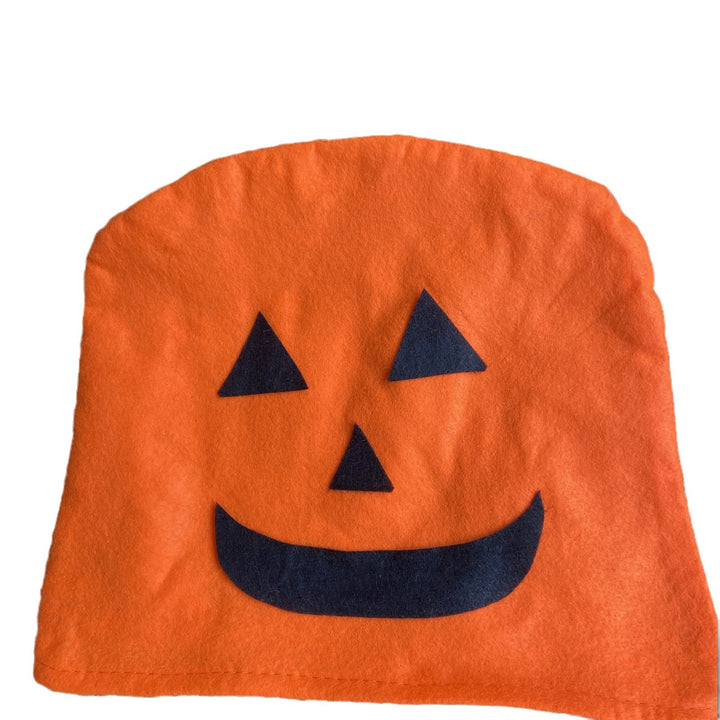 Plush decorative pillow with pumpkin face