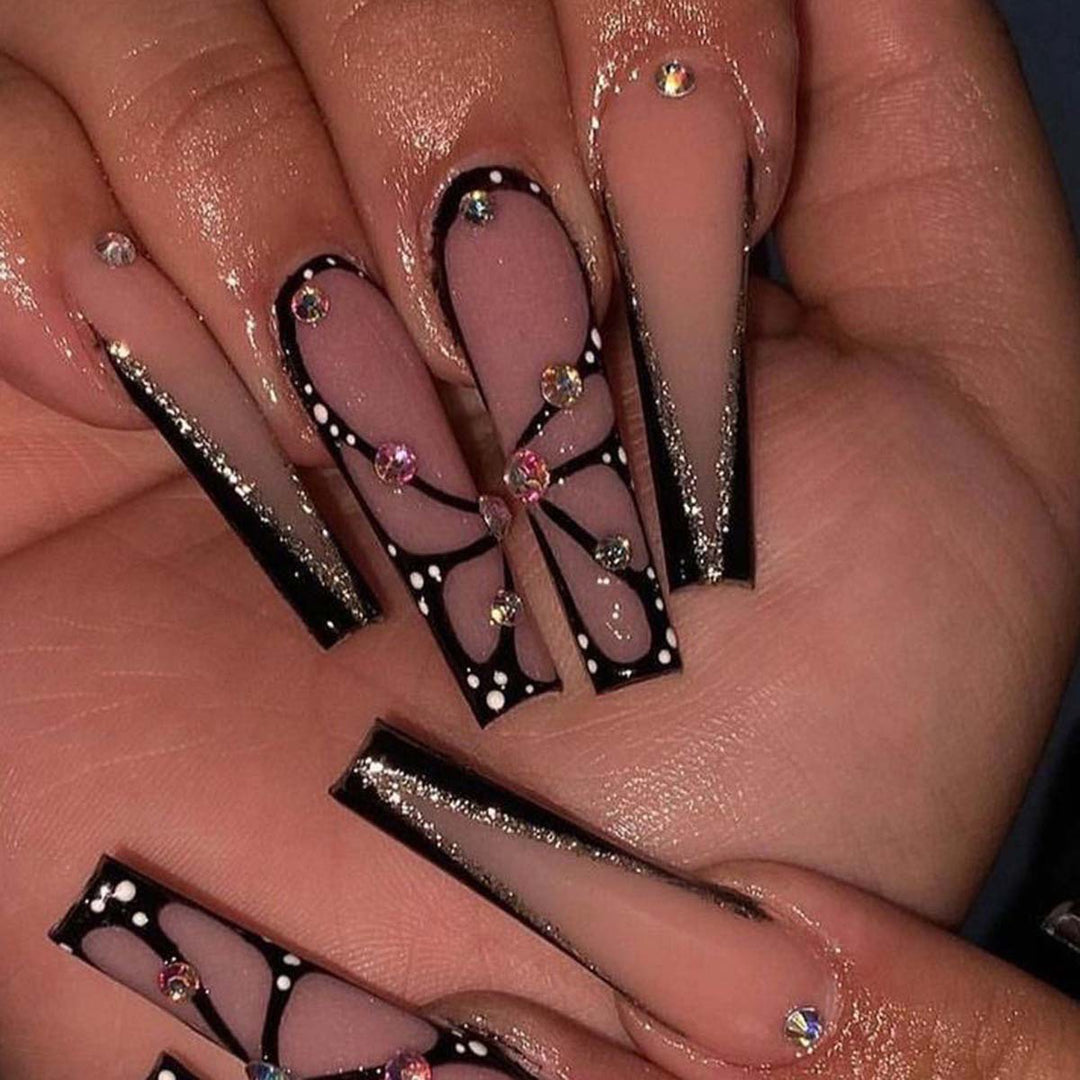 Artful stiletto artificial nails with glitter and butterfly motif Kalsten