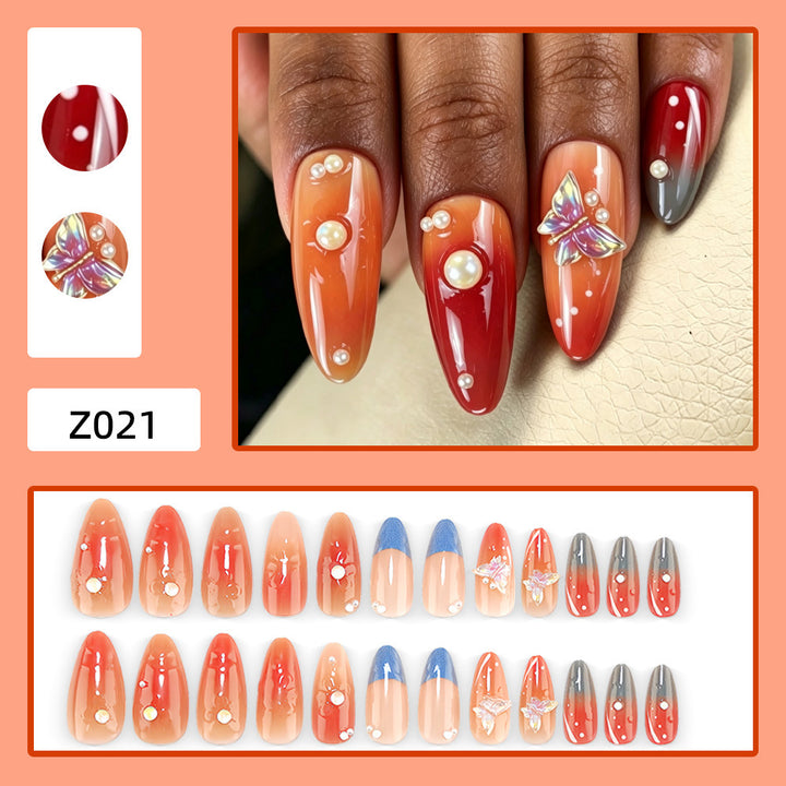 Artful nail art with pearls and butterfly details Kalsten