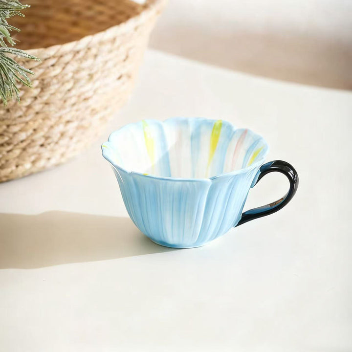 Handcrafted ceramic mug with shell-shaped wave edge and contrasting handle