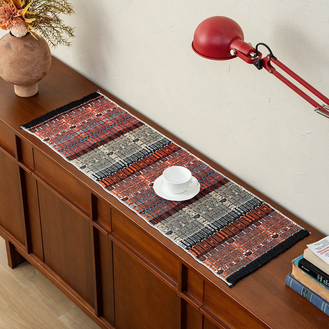 Handwoven table runner made of robust cotton blend with fringes