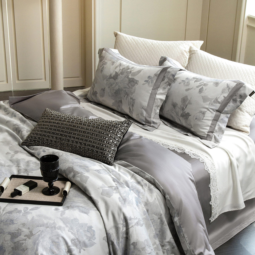 Cotton satin duvet cover set with delicate watercolor floral print, piped edge and matching pillowcases