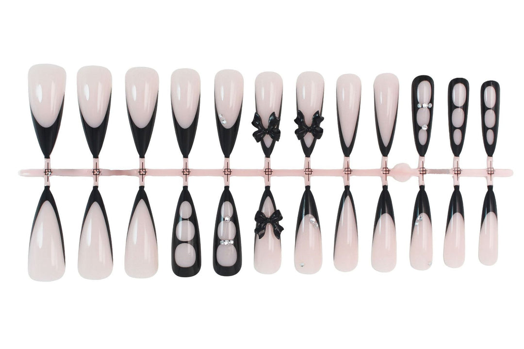 Acrylic nail set with shimmering accents and elegant bows Kalsten