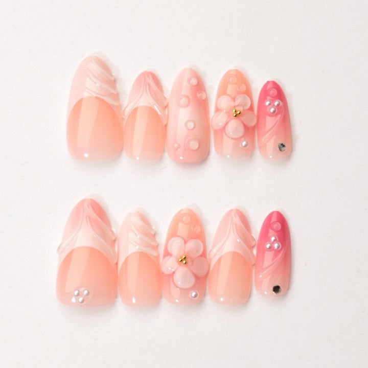 Artificial nail set with delicate floral and glitter accents Kalsten