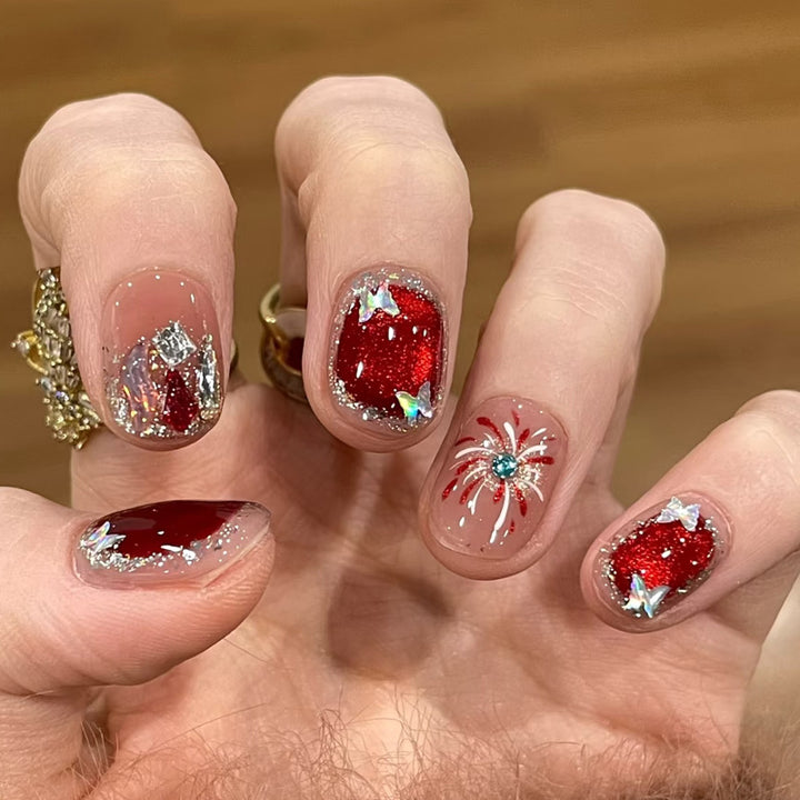 Artificial nail set with festive gift design and elegant glitter accents Kalsten