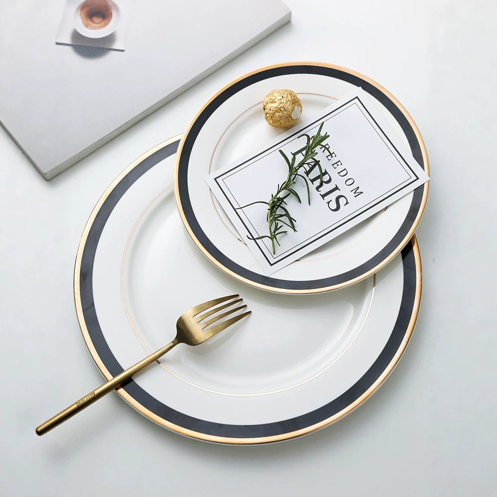Porcelain plate with fine metal rim decoration and contrasting decorative ribbon