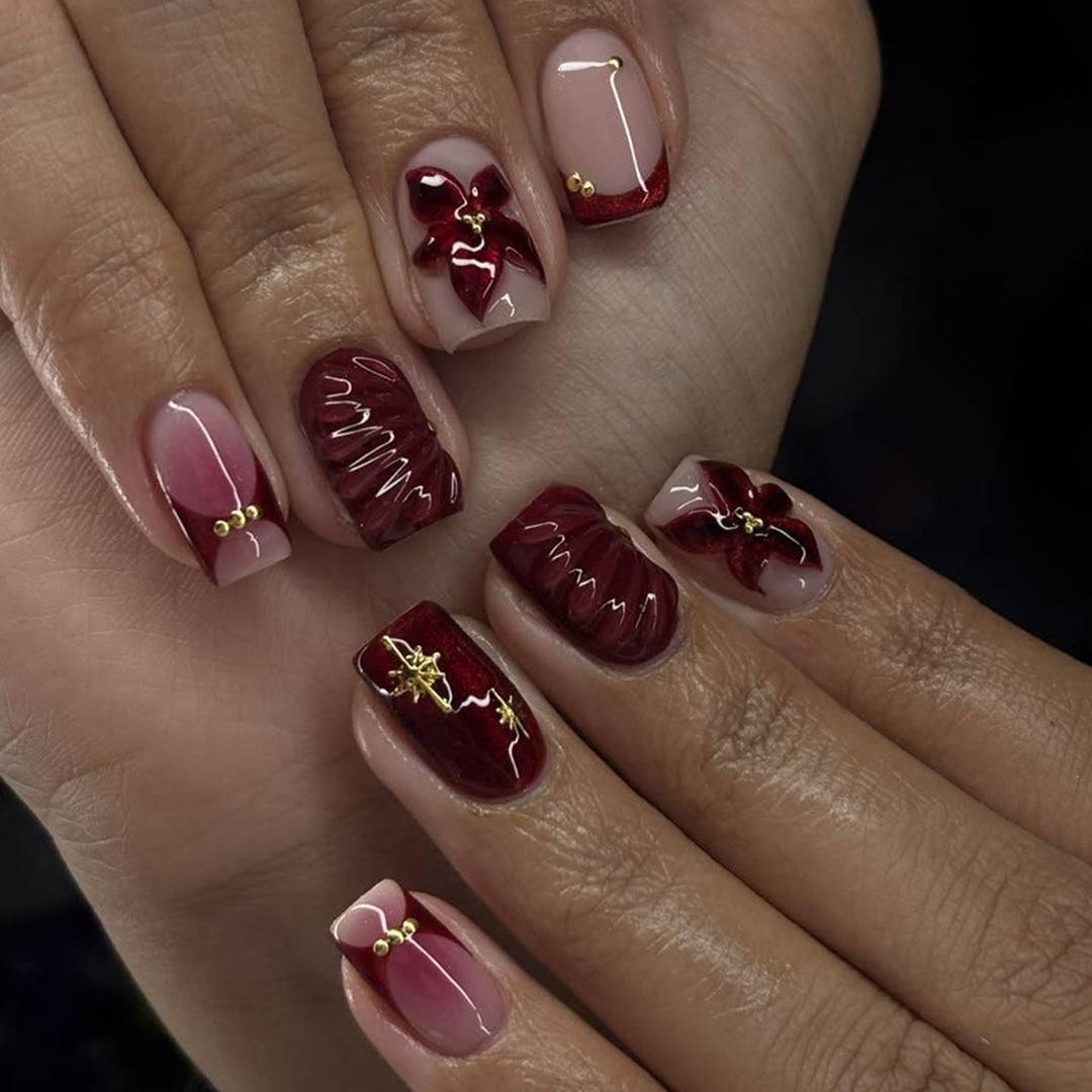 Artful nail design with floral and golden accents Kalsten