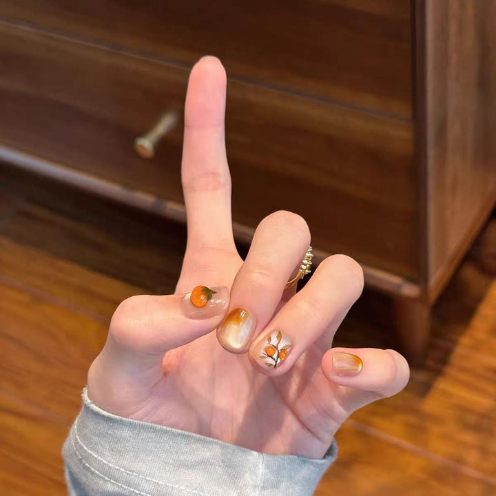Artificial nails with elegant ombre effect and floral accents Kalsten