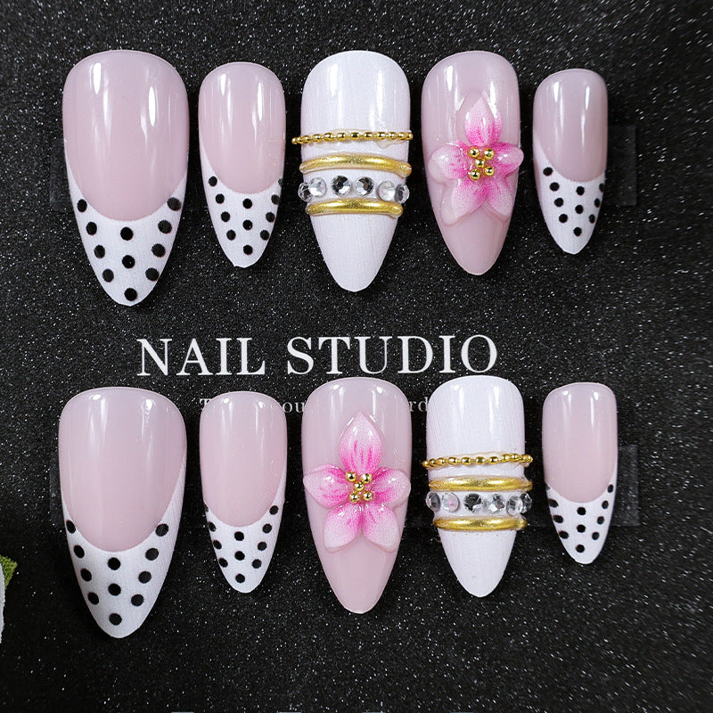 Acrylic nail set with romantic floral patterns and elegant glitter decorations Kalsten
