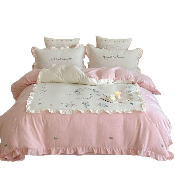 Bedding set with ruffles, embroidered middle cover and delicate flower application