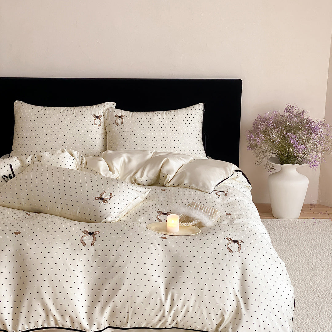 Luxurious satin bedding set with delicate polka dots and bow embroidery