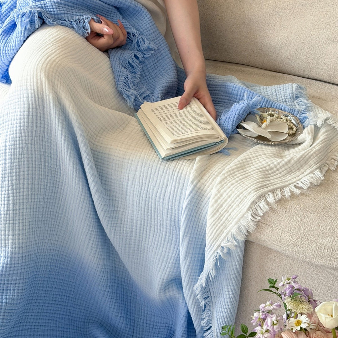 Large waffle blanket with ombre coloring and decorative fringes