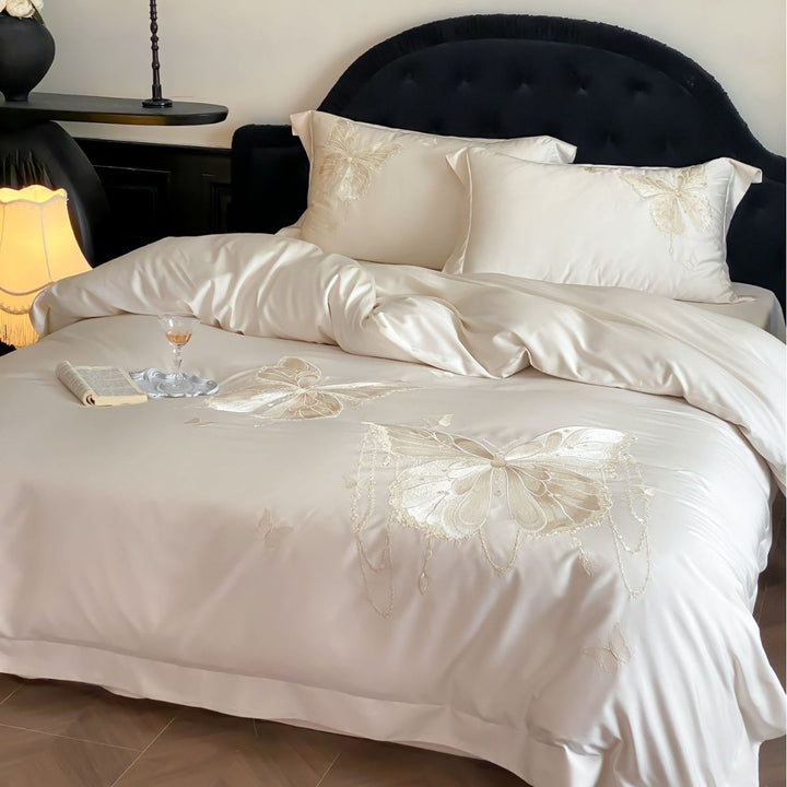 Luxurious satin bedding set with embroidered butterfly motifs and silky glossy finish