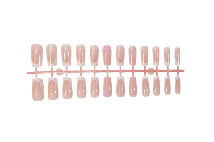 Acrylic nail set with elegant French tips and decorative accents Kalsten