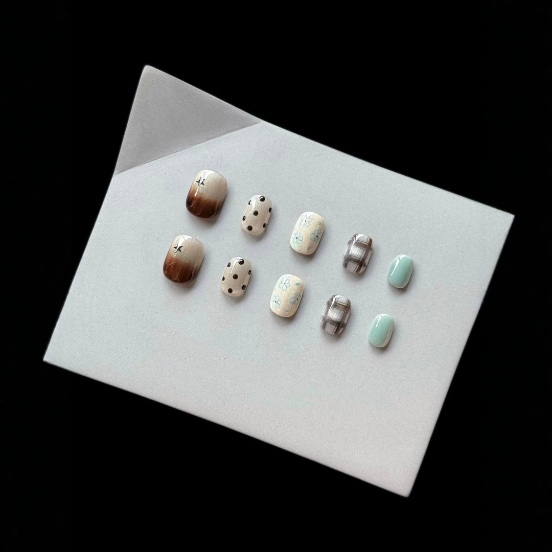 Artistic Press-On Nail Art Set with Elegant Floral and Polka Dot Designs