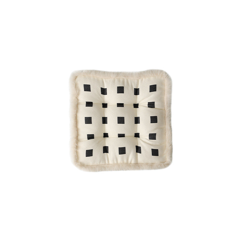 Padded seat cushion with fastening straps and faux fur edge