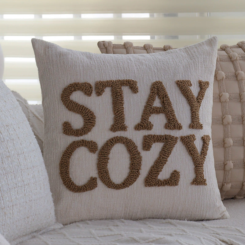 Square cushion cover made of textured bouclé blend with decorative piped seam Kalsten