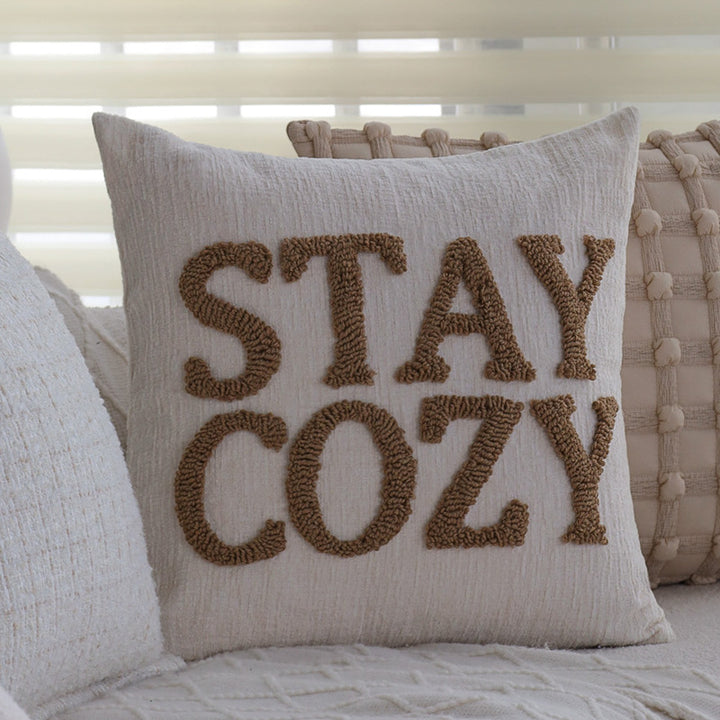 Square cushion cover made of textured bouclé blend with decorative piped seam Kalsten