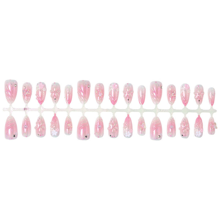 Artificial nail set with sparkling glitter and floral accents Kalsten