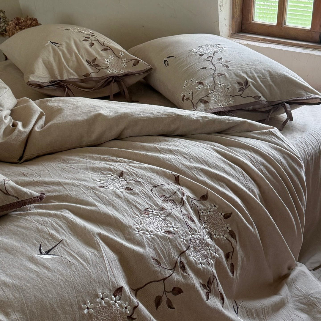 Embroidered bedding set made of linen look with decorative stripes and floral embroidery