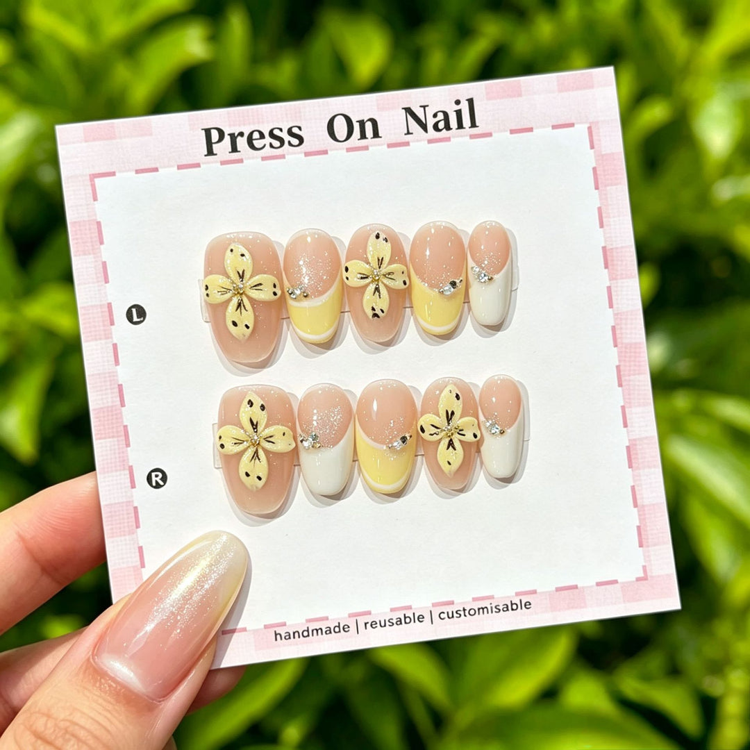 Artistic Press-On Nail Set with Tropical and Floral Accents