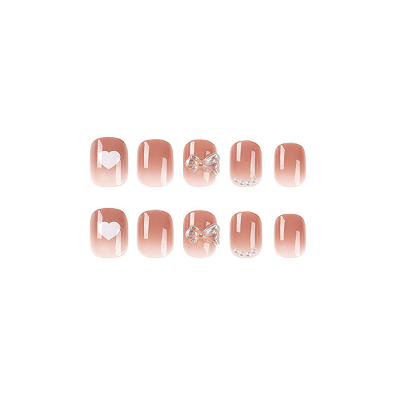 Artificial nails with romantic hearts and glitter accents Kalsten