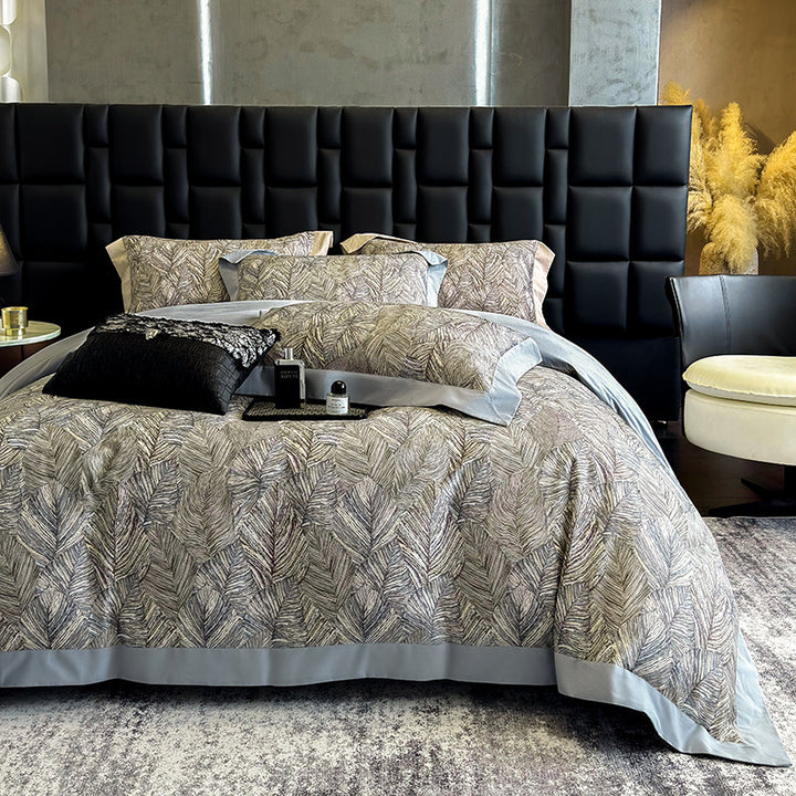 Elegant bed linen set made of cotton satin with a subtle leaf pattern and contrast piping