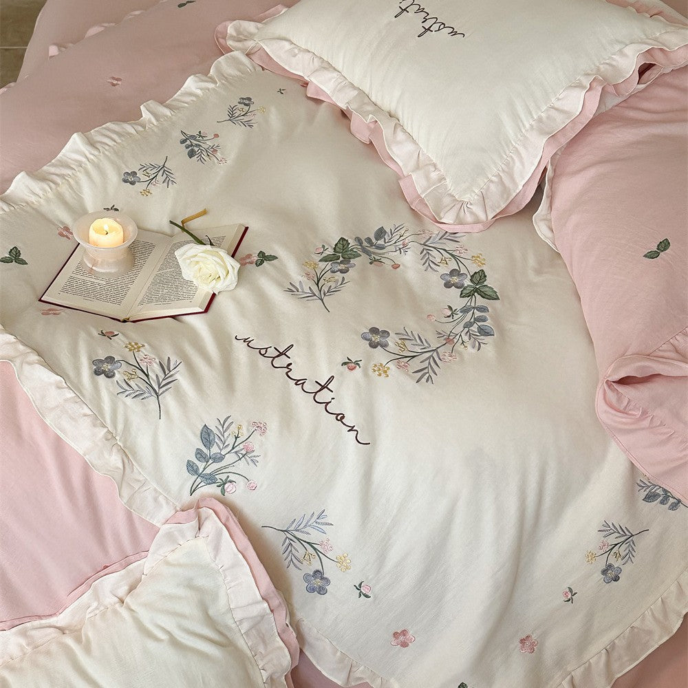 Bedding set with ruffles, embroidered middle cover and delicate flower application
