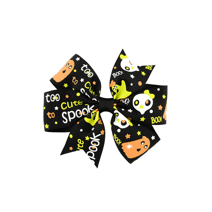 Halloween bow with pumpkin and witch motifs