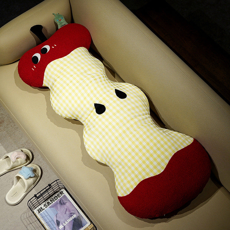 Extra-long ergonomic cuddle body pillow in apple core design with gingham cover and soft plush ends
